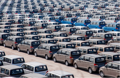 A large commercial fleet in a parking lot.