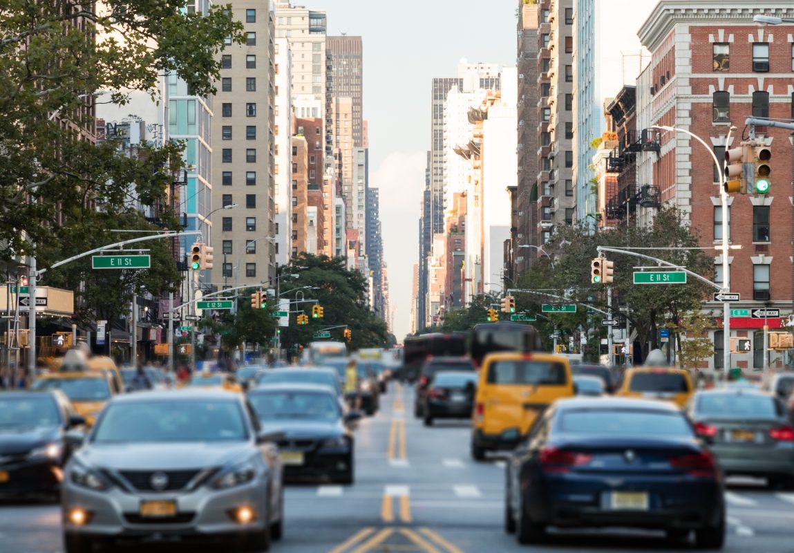 New York City busy street with skyscrapers in the background