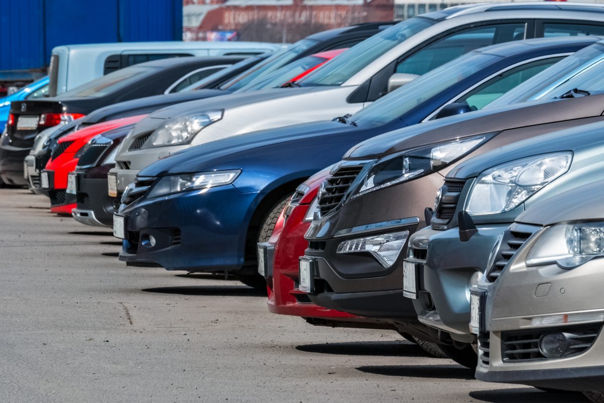 View of the front of the cars parked in a row in the city Parking lot.