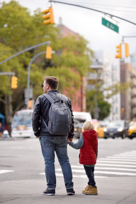 Parent and child at an intersection