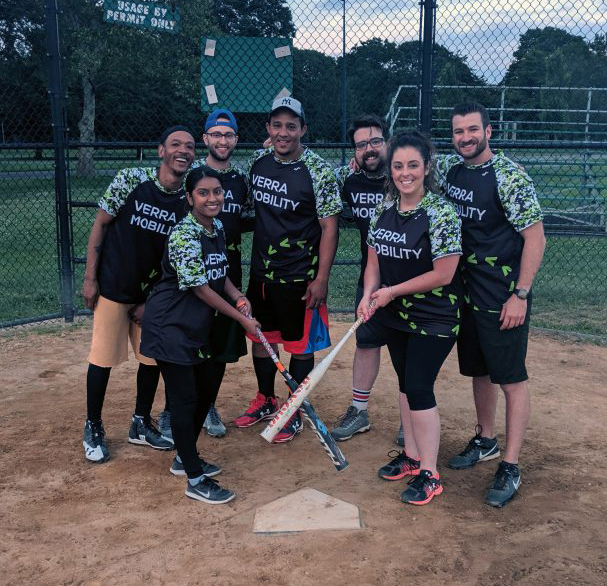 Employees playing softball