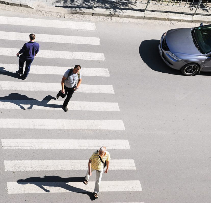 traffic-1-828x1024 people crossing a crosswalk