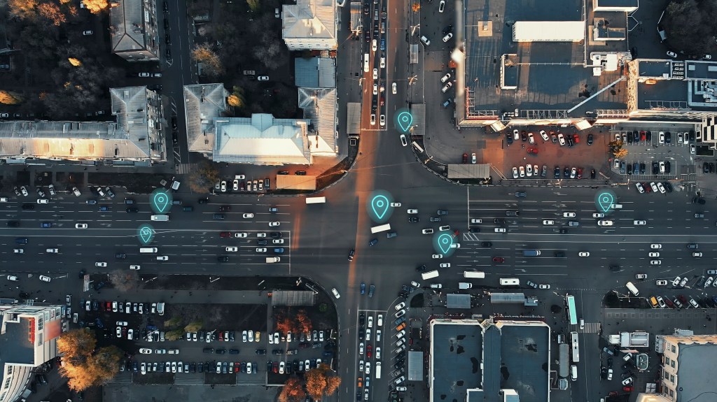Aerial view of city with many cars