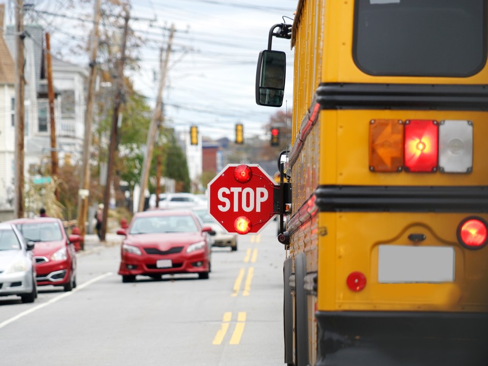 school bus stop arm sign extended