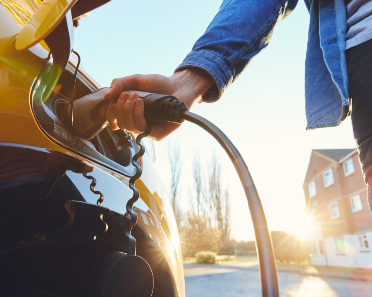 Electric vehicle being charged