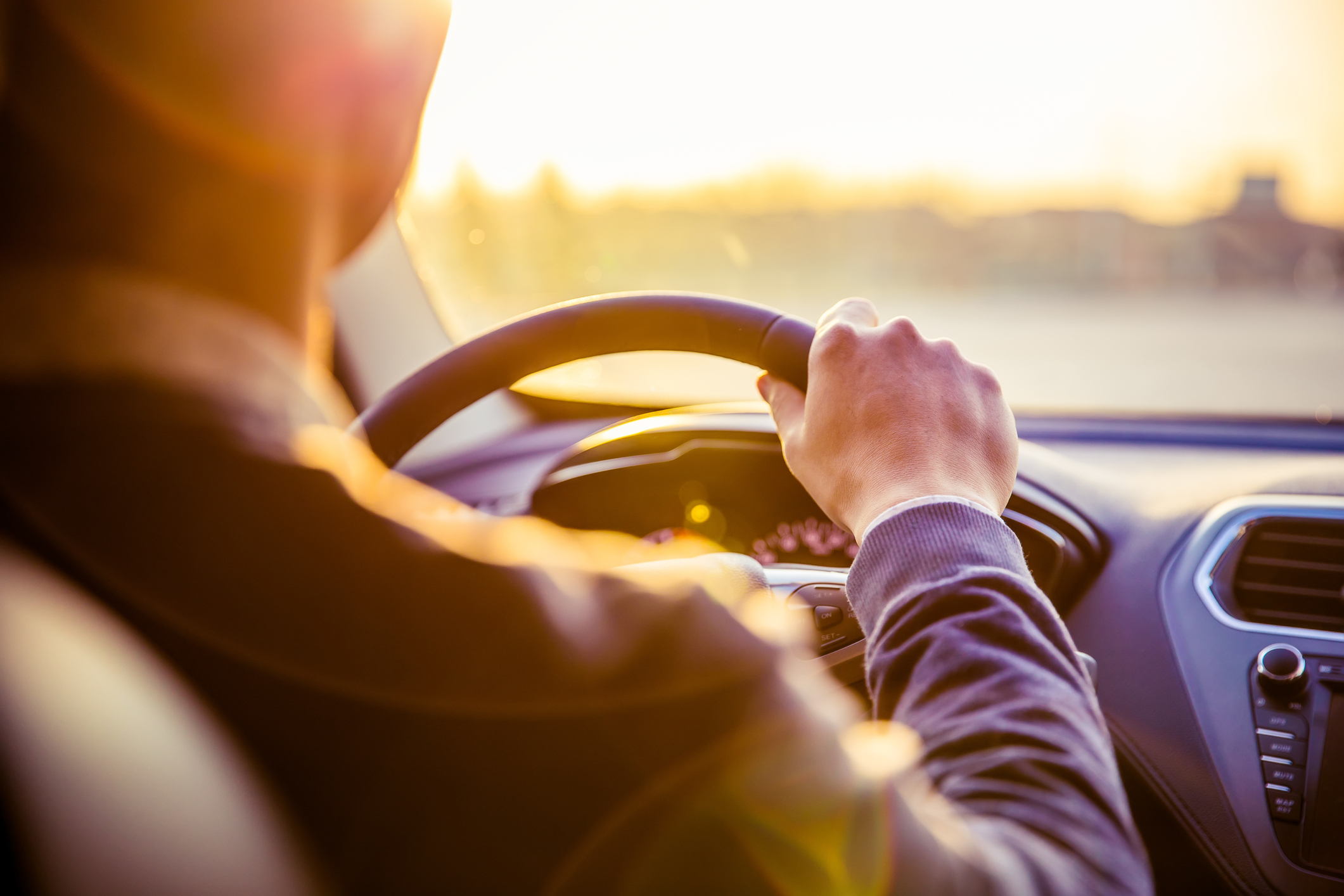 Driver behind the wheel of a car