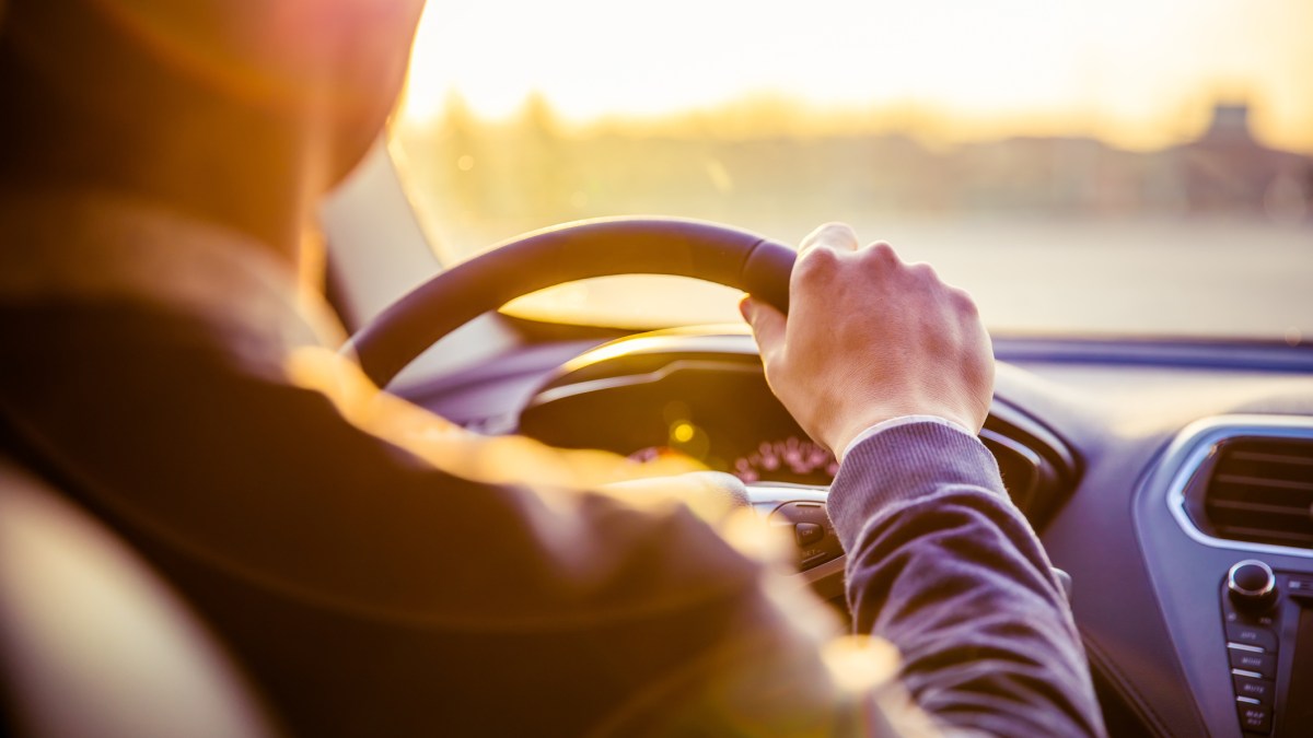 Driver behind the wheel of a car