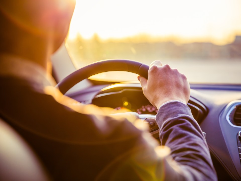 Driver behind the wheel of a car