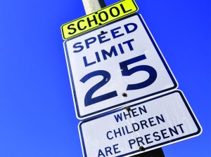 Road sign displaying school zone speed limit