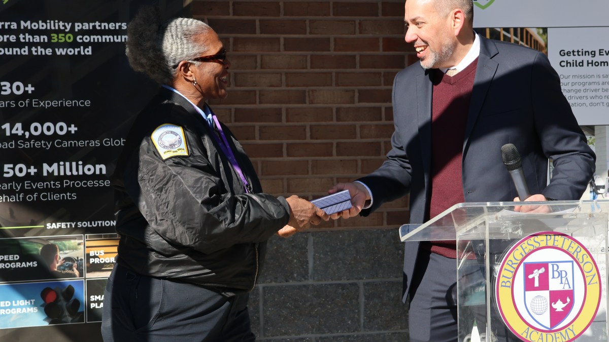 Matt Reich presents Verra Mobility Student Safety Award to Connie Coleman