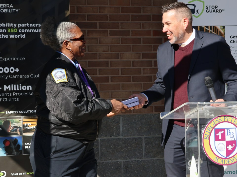Matt Reich presents Verra Mobility Student Safety Award to Connie Coleman