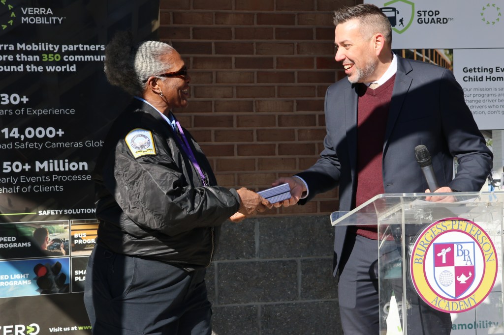 Matt Reich presents Verra Mobility Student Safety Award to Connie Coleman