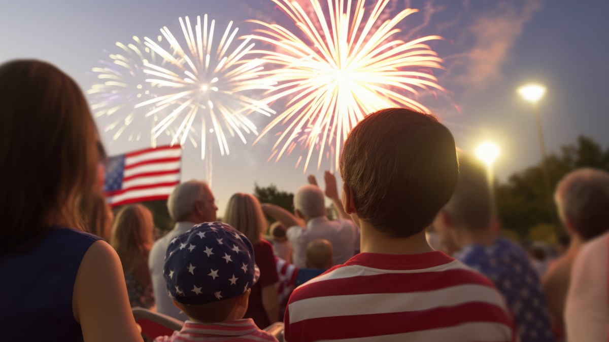 A group of people look at the fireworks for Memorial Day.